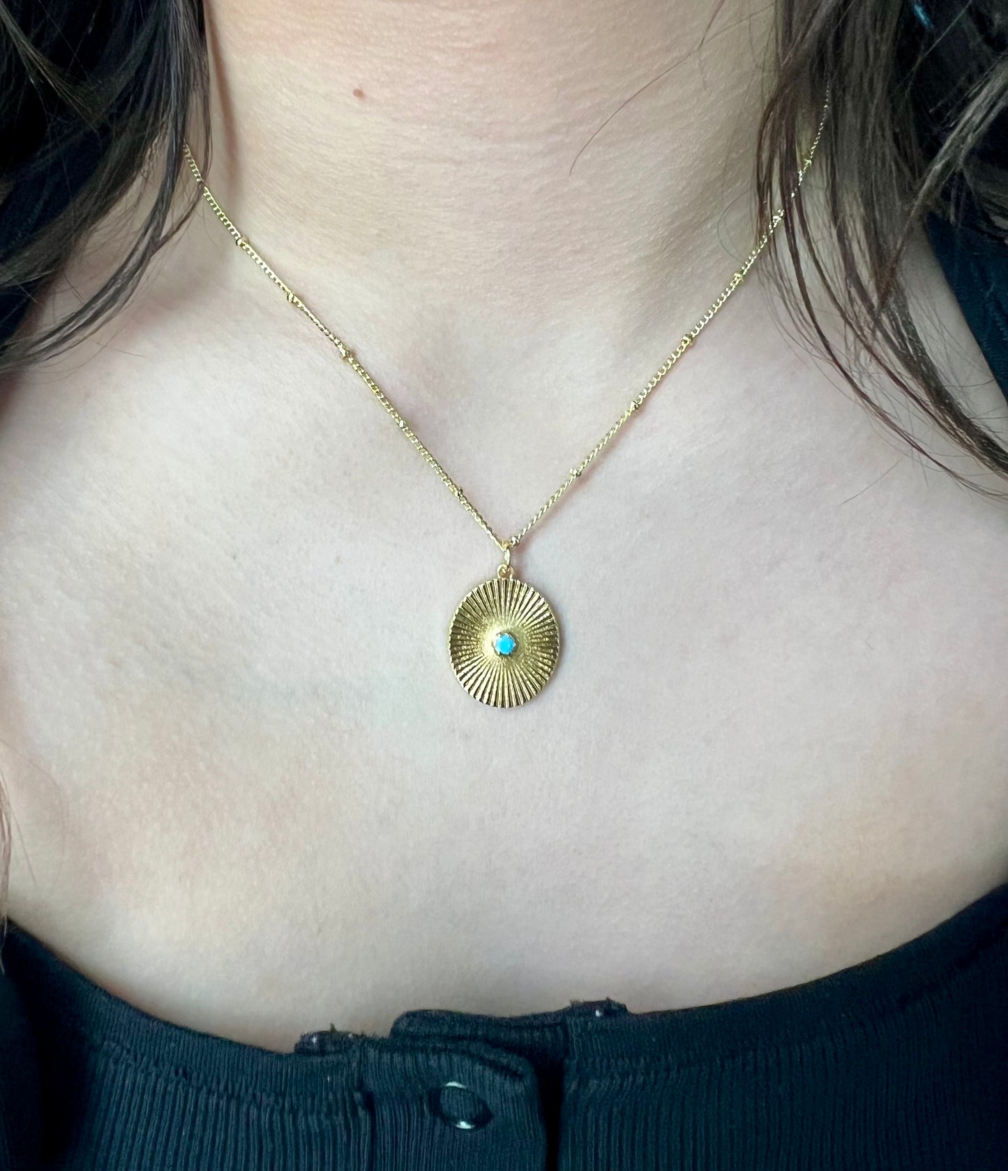 Gold necklace with teal gem